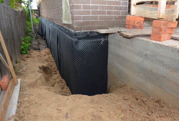 SJ Waterproofing Pros technician performing targeted Interior Drainage System assessment in Albion, IN